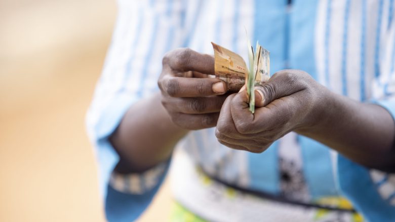 Keli Kathiu Wambua, a member of Kaki Cluster  Village Savings and Loan Association in Kwakavisi Location, Makueni County in Kenya, counts money loaned to her by the association on 29th September 2020. The group, which started in 2016, has 26 members who pool their funds in a kitty from which members can borrow money for personal use like purchase of farming supplies and home improvement.