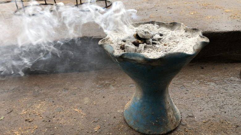 A pot with smoke and coals