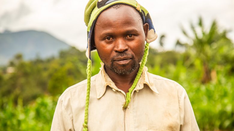 Katembo Mihimba Justin, a farmer and a pastor, poses for a photo outside his home in Musenda, DRC. 

He is a beneficiary of the Food Security project. Like the other beneficiaries, Justin's life has changed thanks to this project. He is a farmer and pastor within the church of the 8th CEPAC in his village